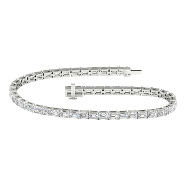 Wide view of a white gold diamond tennis bracelet featuring emerald cut white diamonds set in a continuous line, showcasing the full bracelet design.