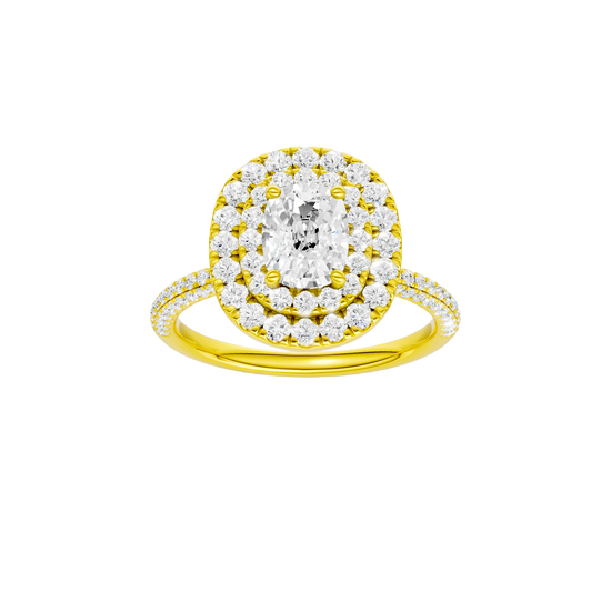 Elongated cushion-cut diamond engagement ring with a pavé-set diamond band and double-halo setting.