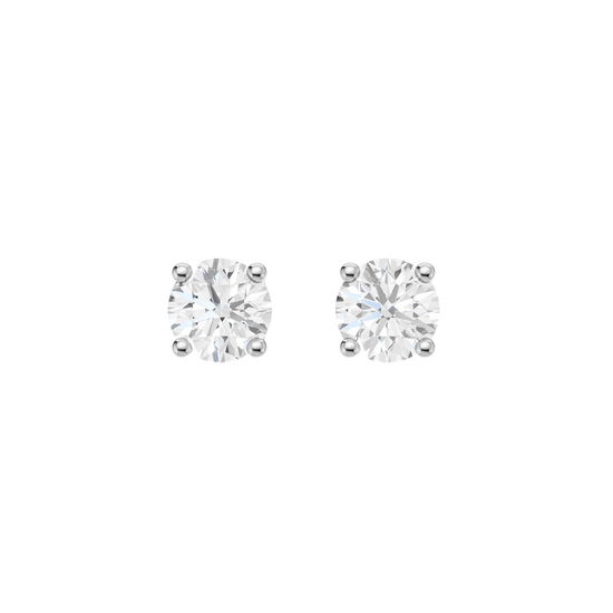 A pair of white gold stud earrings, each featuring a brilliant-cut diamond held in a classic four-prong setting, presented against a dark, transparent checkerboard background.