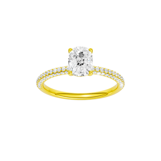 Elongated cushion-cut diamond engagement ring with a pavé-set diamond band and solitaire setting.