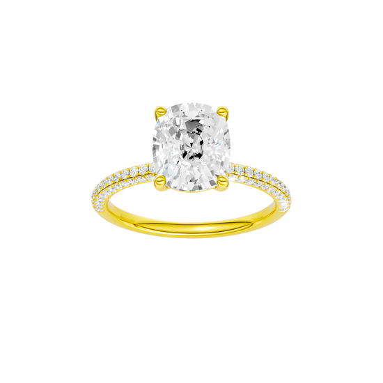 Elongated cushion-cut diamond engagement ring with a pavé-set diamond band and solitaire setting.