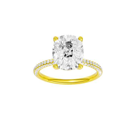 Elongated cushion-cut diamond engagement ring with a pavé-set diamond band and solitaire setting.