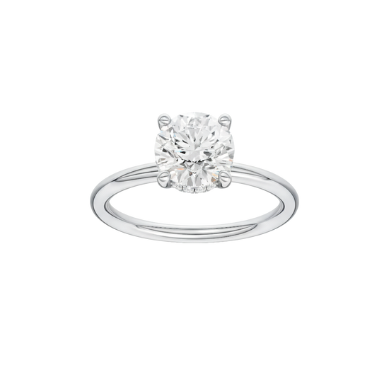 Round-cut diamond engagement ring with a plain band and hidden-halo setting.