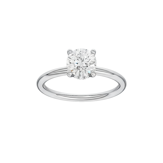 Round-cut diamond engagement ring with a plain band and hidden-halo setting.