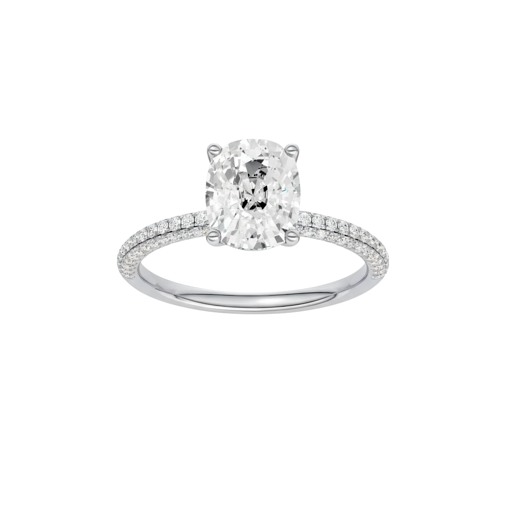 Elongated cushion-cut diamond engagement ring with a pavé-set diamond band and solitaire setting.