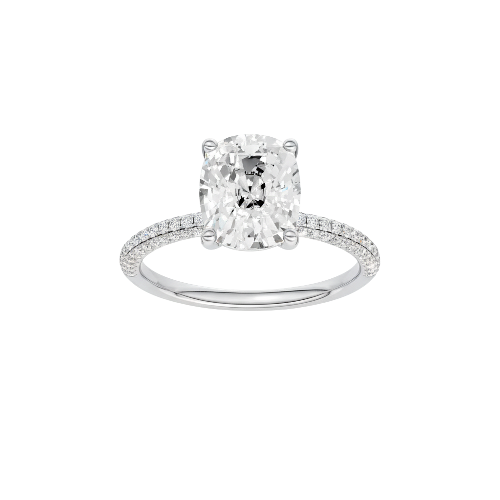 Elongated cushion-cut diamond engagement ring with a pavé-set diamond band and solitaire setting.