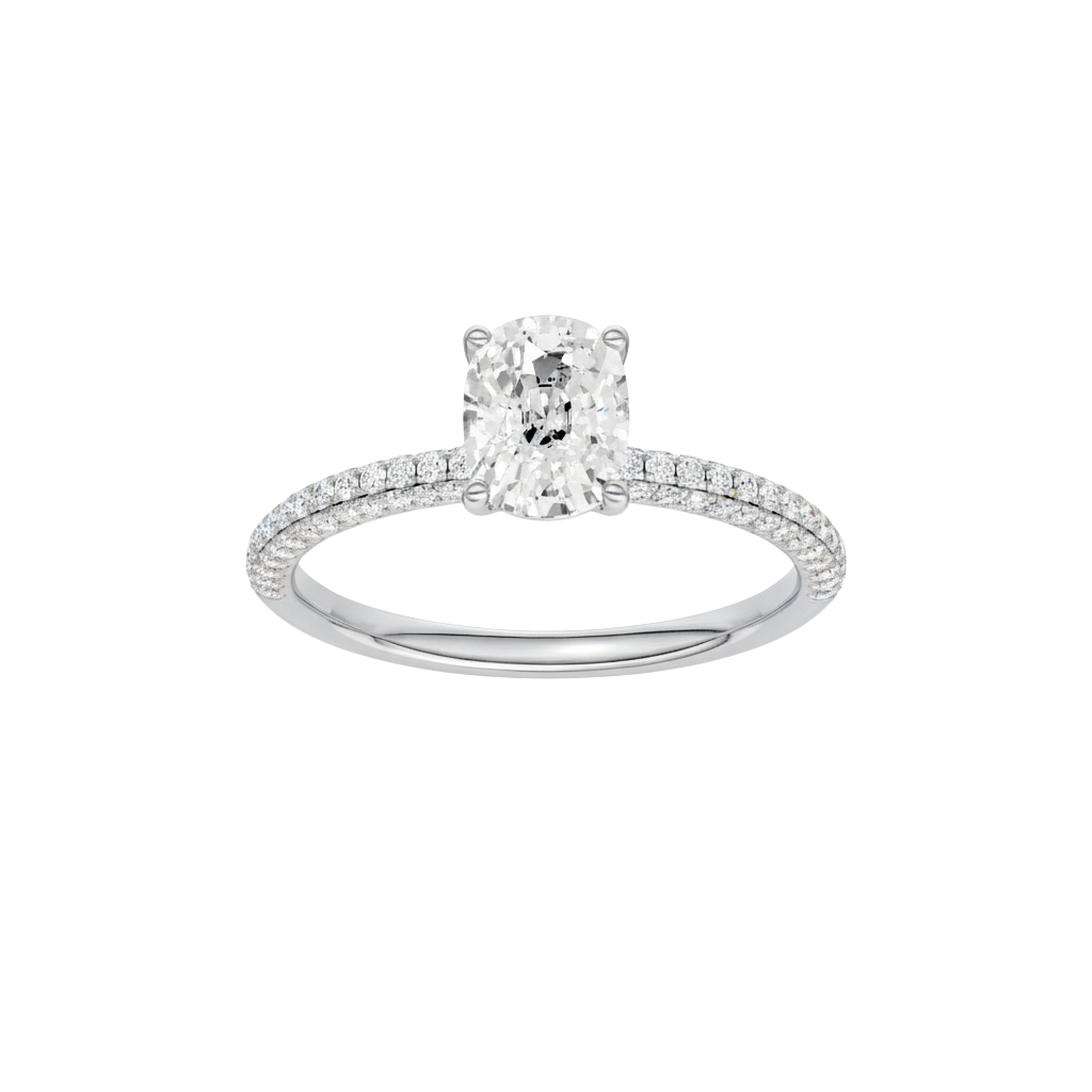 Elongated cushion-cut diamond engagement ring with a pavé-set diamond band and solitaire setting.