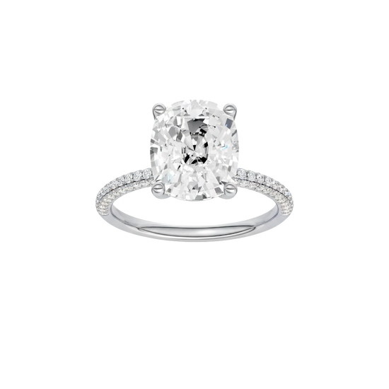 Elongated cushion-cut diamond engagement ring with a pavé-set diamond band and solitaire setting.