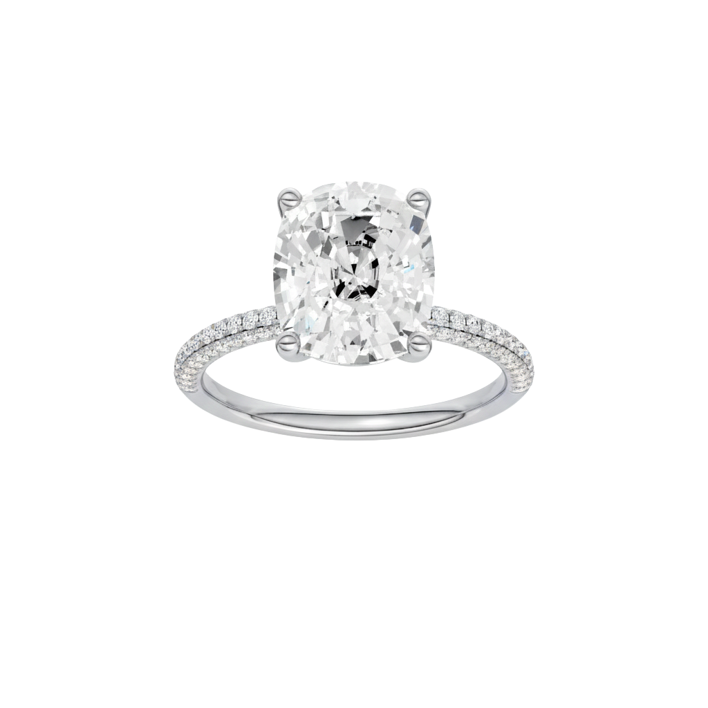 Elongated cushion-cut diamond engagement ring with a pavé-set diamond band and solitaire setting.