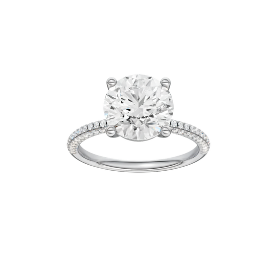 Round-cut diamond engagement ring with a pavé-set diamond band and solitaire setting.