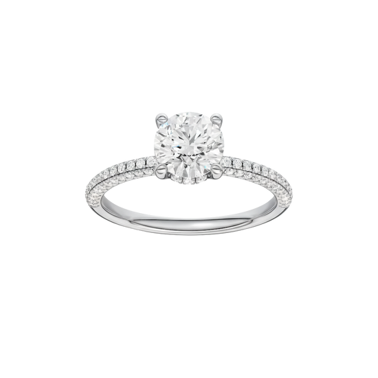 Round-cut diamond engagement ring with a pavé-set diamond band and hidden-halo setting.