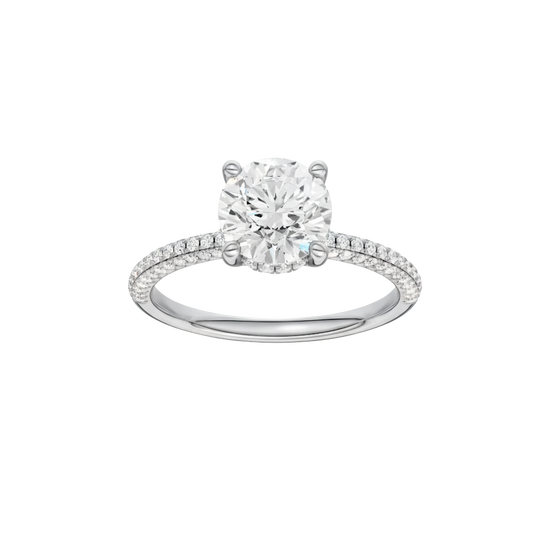 Round-cut diamond engagement ring with a pavé-set diamond band and hidden-halo setting.