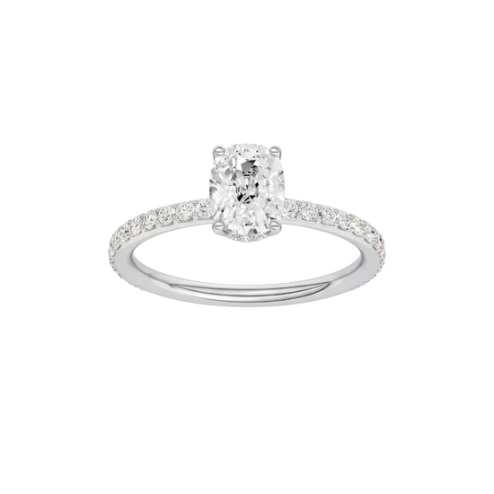 Elongated cushion-cut diamond engagement ring with a prong-set diamond band and hidden-halo setting.