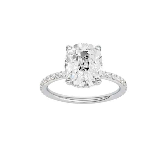 Elongated cushion-cut diamond engagement ring with a prong-set diamond band and hidden-halo setting.