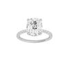 Elongated cushion-cut diamond engagement ring with a prong-set diamond band and hidden-halo setting.