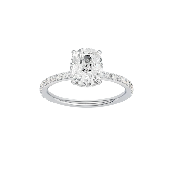Elongated cushion-cut diamond engagement ring with a prong-set diamond band and hidden-halo setting.
