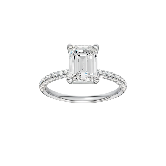 Emerald-cut diamond engagement ring with a pavé-set diamond band and solitaire setting.