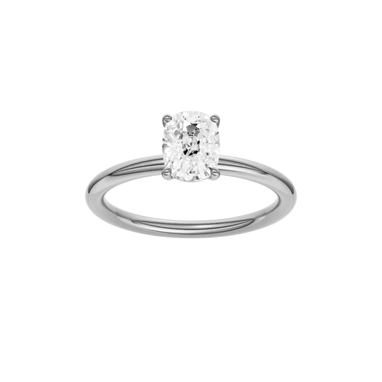 Elongated cushion-cut diamond solitaire engagement ring in 14k white gold with a plain band