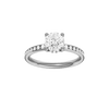 Round-cut diamond engagement ring with a channel-set diamond band and hidden-halo setting.