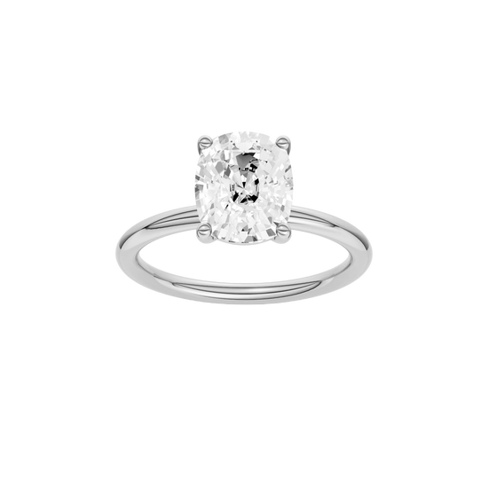 Elongated cushion-cut diamond solitaire engagement ring in 14k white gold with a plain band