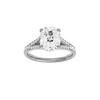 Elongated cushion-cut diamond engagement ring with a channel-set diamond band and hidden-halo setting.