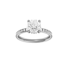 Round-cut diamond engagement ring with a channel-set diamond band and hidden-halo setting.