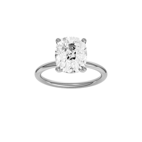 Elongated cushion-cut diamond solitaire engagement ring in 14k white gold with a plain band