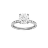 Round-cut diamond engagement ring with a channel-set diamond band and hidden-halo setting.