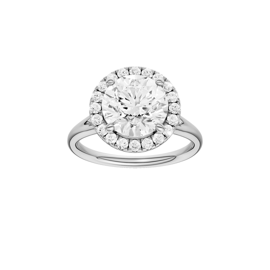 Round-cut diamond engagement ring with a plain band and halo setting.