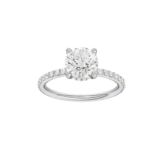 Round-cut diamond engagement ring with a prong-set diamond band and hidden-halo setting.