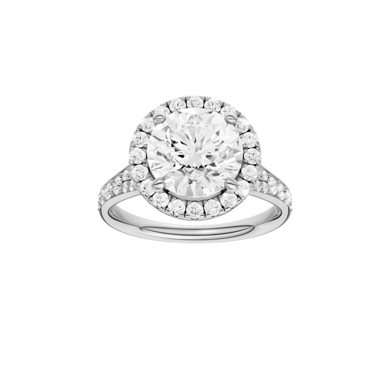 Round-cut diamond engagement ring with a channel-set diamond band and halo setting.