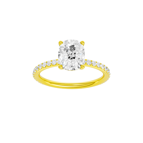 Elongated cushion-cut diamond engagement ring with a prong-set diamond band and solitaire setting.