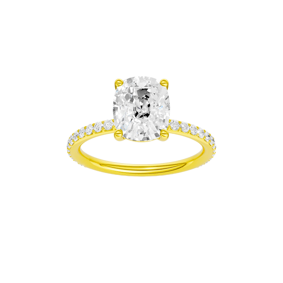 Elongated cushion-cut diamond engagement ring with a prong-set diamond band and solitaire setting.