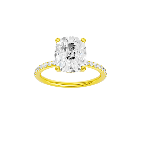 Elongated cushion-cut diamond engagement ring with a prong-set diamond band and solitaire setting.