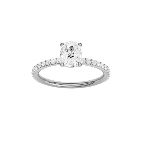 Elongated cushion-cut diamond engagement ring with a prong-set diamond band and solitaire setting.