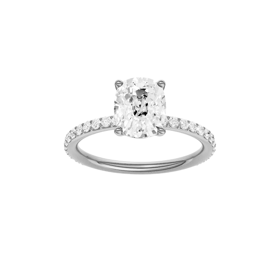 Elongated cushion-cut diamond engagement ring with a prong-set diamond band and solitaire setting.