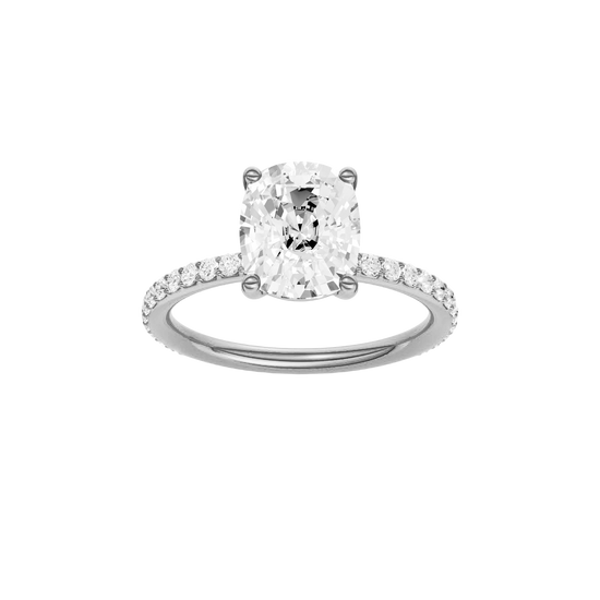 Elongated cushion-cut diamond engagement ring with a prong-set diamond band and solitaire setting.