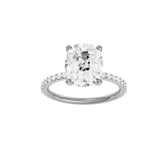 Elongated cushion-cut diamond engagement ring with a prong-set diamond band and solitaire setting.