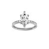 Marquise-cut diamond engagement ring with a channel-set diamond band and hidden-halo setting.