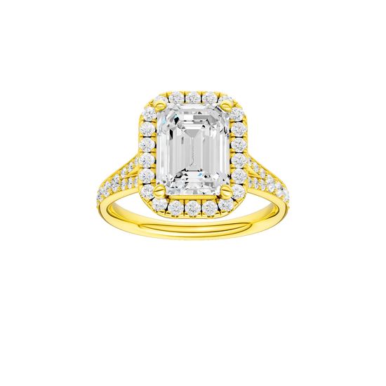 Emerald-cut diamond engagement ring with a channel-set diamond band and halo setting.