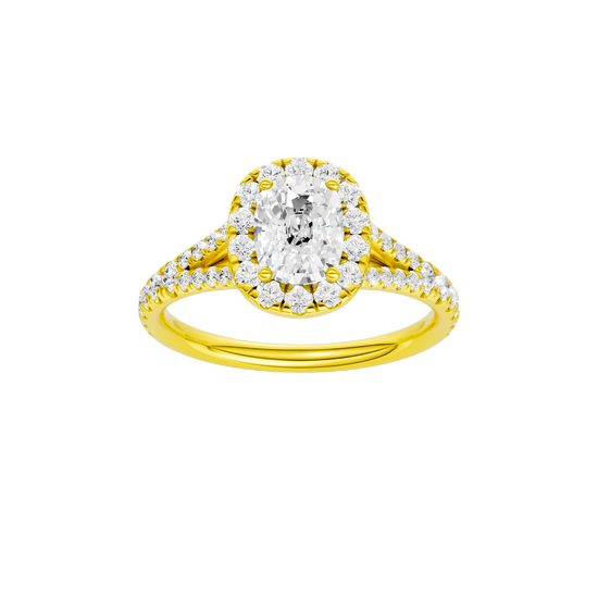 Elongated cushion-cut diamond engagement ring with a prong-set diamond band and halo setting.