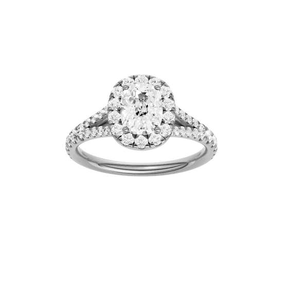 Elongated cushion-cut diamond engagement ring with a prong-set diamond band and halo setting.