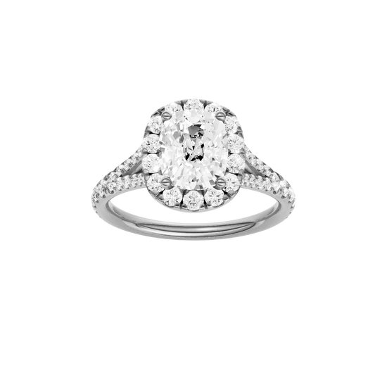 Elongated cushion-cut diamond engagement ring with a prong-set diamond band and halo setting.