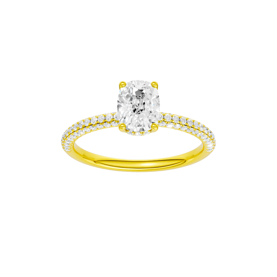 Elongated cushion-cut diamond engagement ring with a pavé-set diamond band and hidden-halo setting.