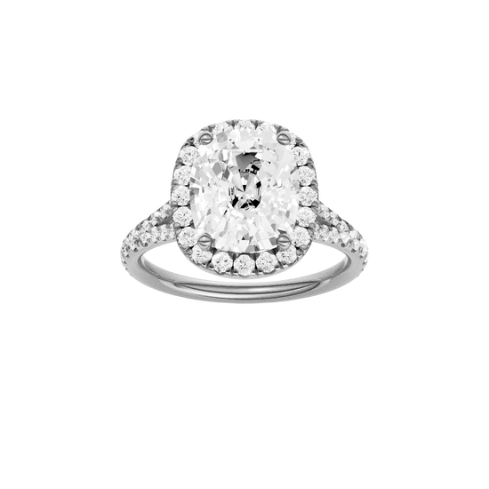 Elongated cushion-cut diamond engagement ring with a prong-set diamond band and halo setting.