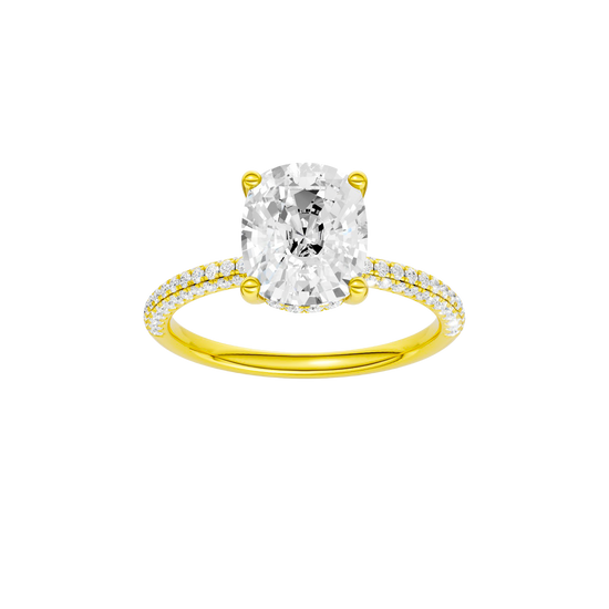 Elongated cushion-cut diamond engagement ring with a pavé-set diamond band and hidden-halo setting.