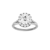 Elongated cushion-cut diamond engagement ring with a prong-set diamond band and halo setting.