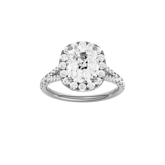 Elongated cushion-cut diamond engagement ring with a prong-set diamond band and halo setting.