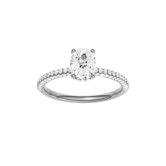Elongated cushion-cut diamond engagement ring with a pavé-set diamond band and hidden-halo setting.