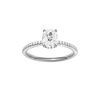 Elongated cushion-cut diamond engagement ring with a pavé-set diamond band and hidden-halo setting.